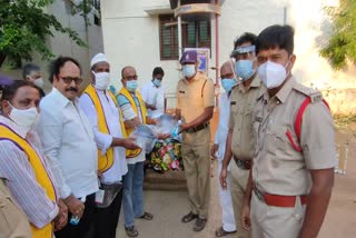 Lions Club representatives distribute safety items to police