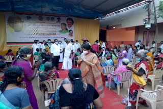 DMK mp Kanimozhi distributing welfare packages for party late leader Karunanidhi's birthday anniversary celebration
