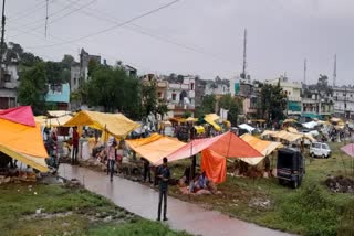 Weekly market in the ground outside the main road