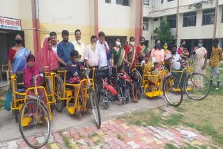 Tricycles and wheelchairs distributed among the differently abled in Jamshedpur