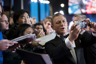 i cannot surviving with these selfies and cameras, says Bond