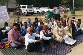 Villagers sitting on strike.