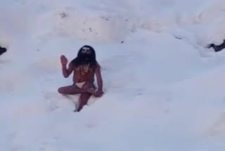 a monk doing spiritual practice in snow at yamunotri dham in uttarakhand