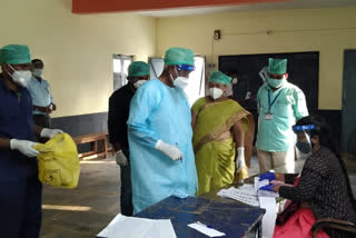 voting by covid infected by wearing PPE kit news