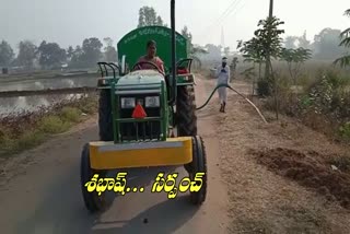 sarpanch-drives-tractor-for-water-to-plants-at-bhadyathanda-in-medak-district