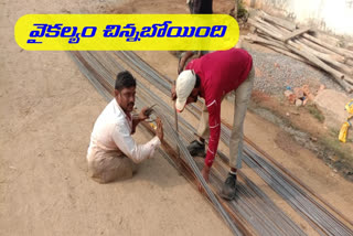 handicapped person doing  centring works in suryapeta dist