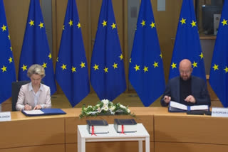 EU officials sign post-Brexit trade deal with UK