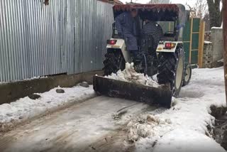 snow removal continues in ganderbal