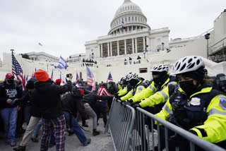 Trump supporters try to break through a police barrier, Wednesday, Jan. 6, 2021, at the Capitol in Washington