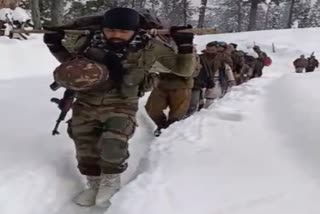 Army personnel in Sopore carried a woman and her newborn on a stretcher in Jammu Kashmir