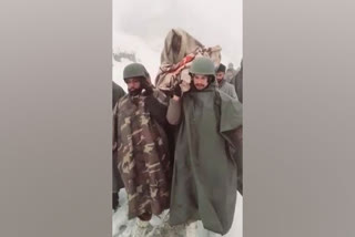 Army soldiers carry ailing woman on shoulders  Snowfall in Jammu  Kashmir snowfall  Buthu village  soldiers carried lady for 8 km on soldiers  ജമ്മു കശ്‌മീരിൽ കനത്ത മഞ്ഞുവീഴ്‌ച  രോഗിയായ വൃദ്ധയെ ചുമന്ന് സൈനികർ  ഇന്ത്യൻ സൈനികർ  മഞ്ഞുവീഴ്‌ച