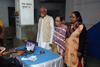 Jhargram district BJP president sukhoamoy satpathy family stands in queue & collect Swasthya Sathi card