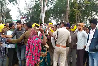 women beating forest guards