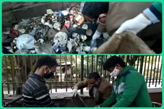 people are picking up the garbage In Adarsh Nagar