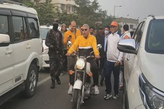 dilip-ghosh-state-president-of-bjp-in-a-controversy-when-riding-bike-without-helmet