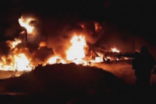 An explosion Tuesday in an oil tanker outside a state fuel distribution company in central Syria caused a massive fire, state media reported.