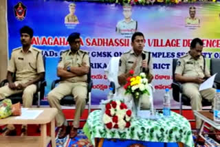 SP Amit Bardar with members of village protection forces and women protection secretaries in Srikakulam district