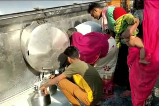 people filled milk in vessel, milk tanker overturned