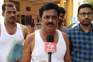 farmer half naked protest before railway koduru tahsildar office