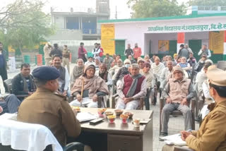 Police officials talk to villagers about upcoming Gram Panchayat elections in ghaziabad