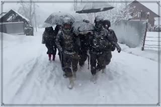 Indian Army personnel carried a woman on a stretcher for almost 6-km