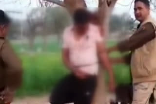 family tied the accused to a tree and beaten him