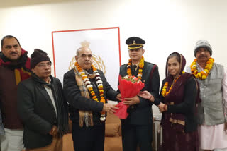 Cabinet Minister Moolchand Sharma congratulates Anand on becoming Captain in the Army