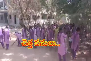 students cleaning wastes in the school ground