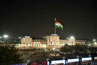 The thirty-month-old flag flutters between the lights