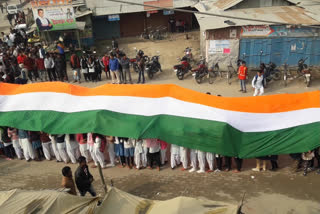 cultural rally with 100 ft flag