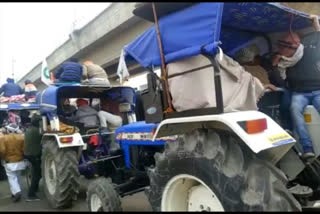 farmers taking out tractor rally peacefully at tikri border