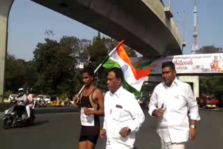 A young man running with the flag, fostering a sense of nationalism