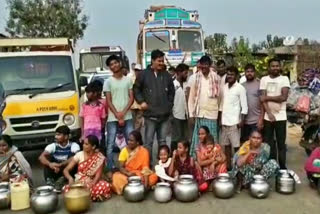 Protest with empty bins for water in Vegam village in Kannepalli zone