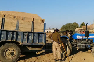 trolleys transporting illegal sand