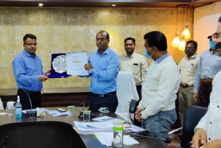 Collector Chandan Kumar awarding CEO Sanjay Kannauje