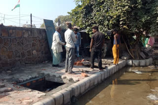 PWD putting lids on open drains