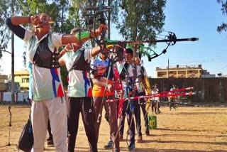 ITBP jawans giving archery training to children