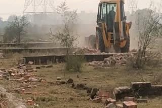 vda bulldozer run on illegal plotting in varanasi