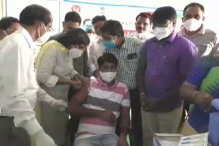 nizamabad Collector taking the first dose of the covid-19 vaccine