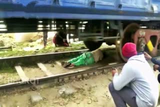 A woman saved her life by lying down on a railway track in Haryana's Rohtak