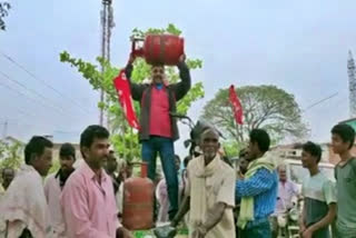 People staged a protest under the auspices of CITU in Komarada, Vizianagaram district, demanding reduction in oil prices