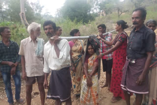 No proper roads, villagers carry sick woman on makeshift stretcher