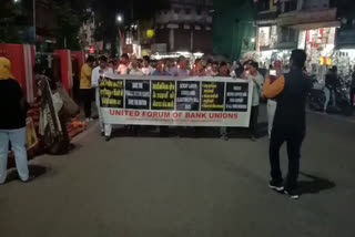 Bank workers take out candle march