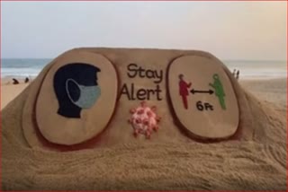 corona awareness with sand art by sudarshan patnaik