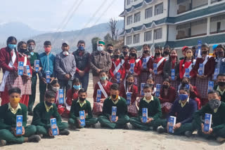 Steel bottles being distributed by government to students at Dhar Gaura School in Rampur