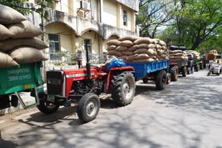 tumkur farmers bringing  Millet crop to Purchase Center