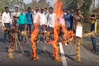 adivasi student union protest at tinisukia