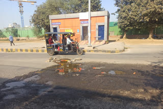 Drivers and passers-by disturbed pits filled with dirty water of Dwarka