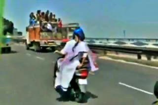 Mamata Banerjee travels on an electric scooter in Kolkata as a mark of protest against rising fuel prices