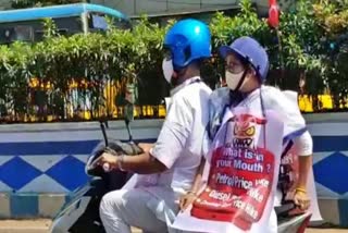 Mamata Banerjee travels on an electric scooter in Kolkata